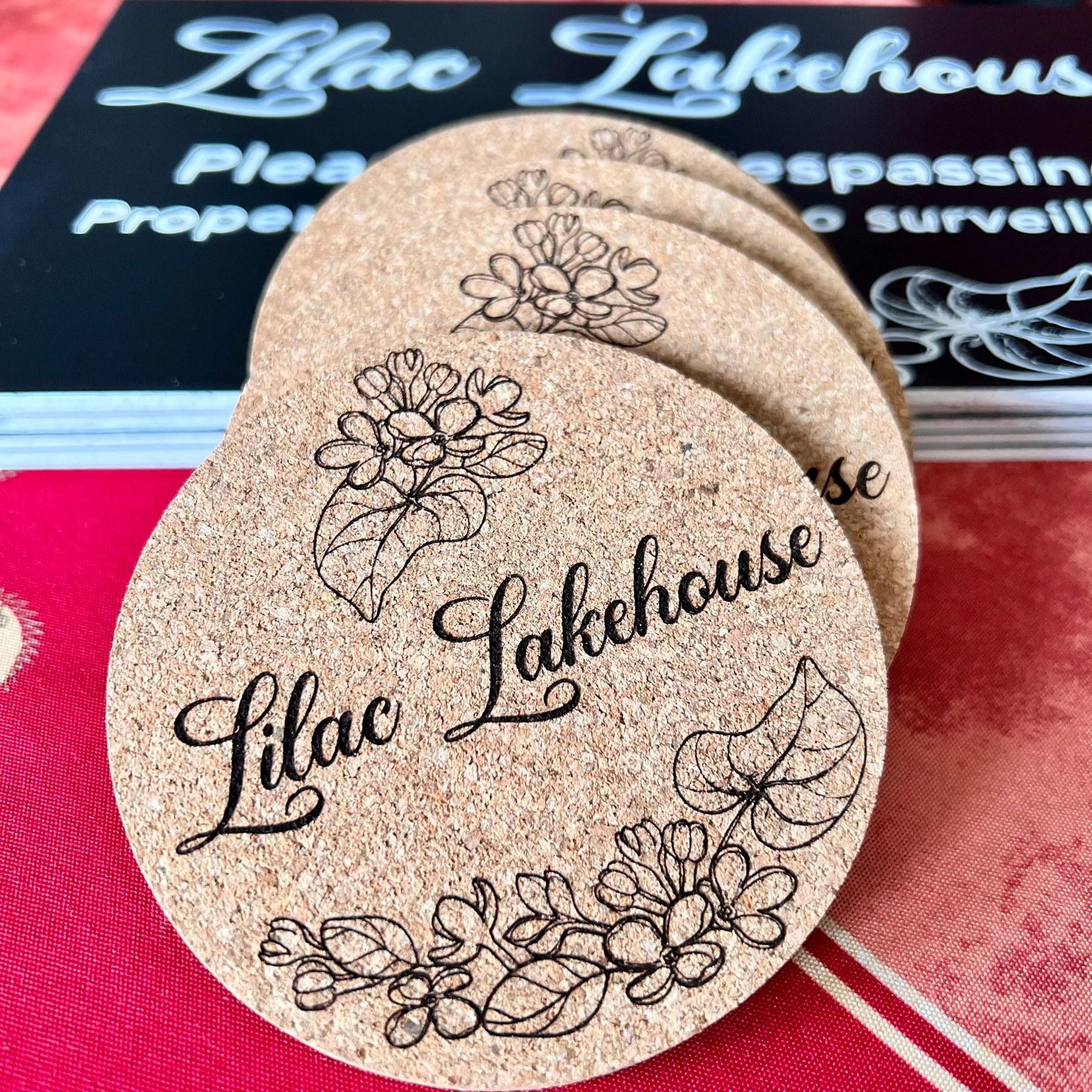 Round Lilac Lakehouse engraved wood coasters | Solo AI website creator