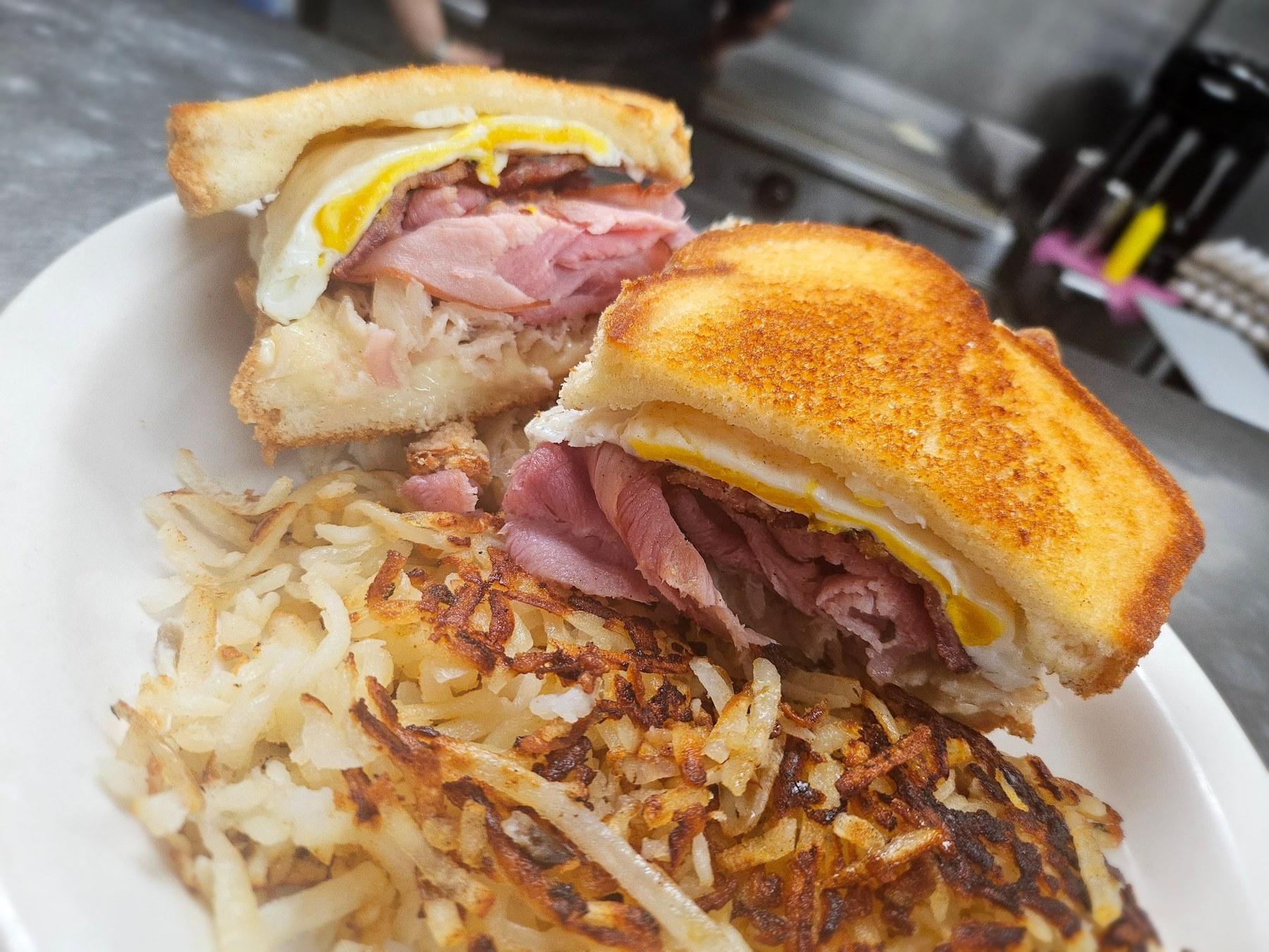 Breakfast sandwich with ham, egg, and hash browns | Solo AI website creator
