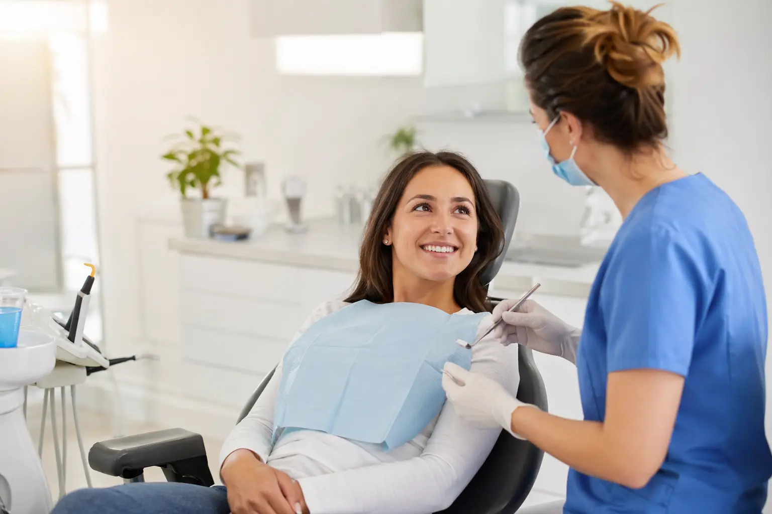 Squarespace for dentists — man in blue dress shirt and blue denim jeans standing near black flat screen computer monitor