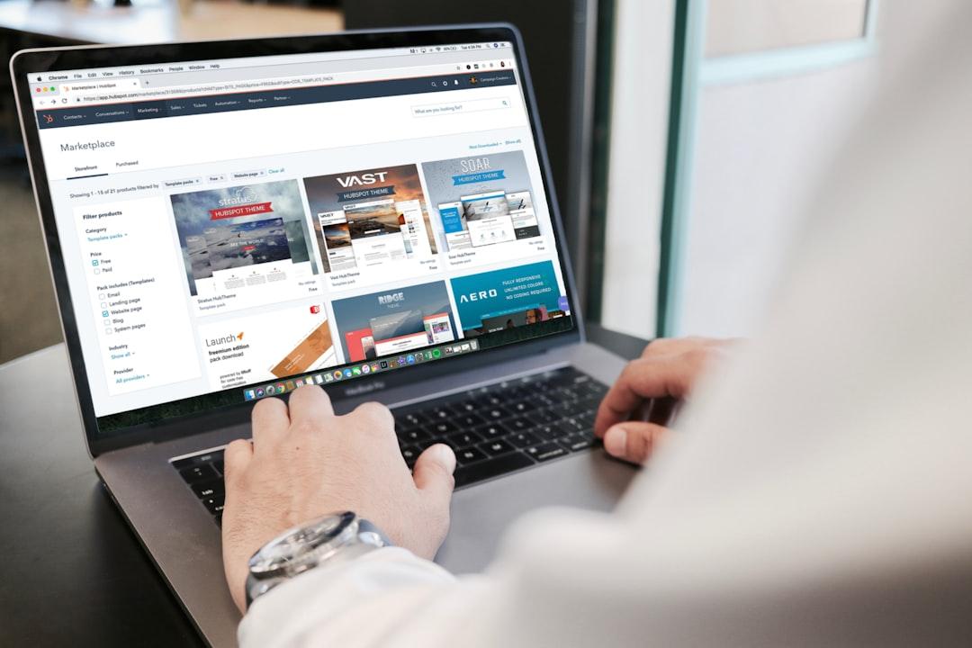 Person browsing marketplace templates on laptop screen showing website design options and layouts